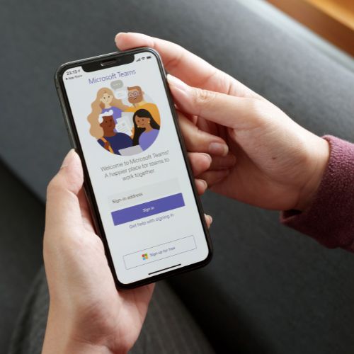 Microsoft Teams Phone - close up of a mobile phone handset with Microsoft Teams on the screen