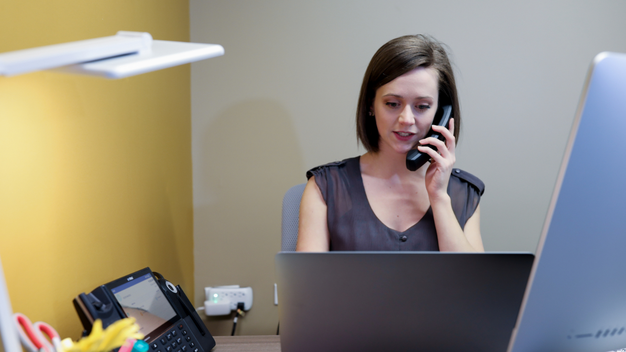 Woman on Phone - VoIP Phone Systems