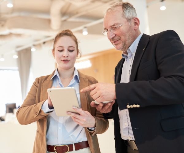 People using an ipad - Streamlined Communications