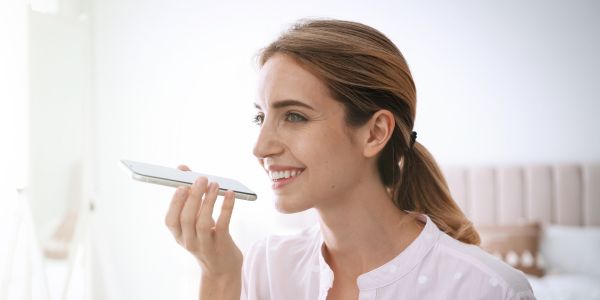 Woman Talking To Phone - Conversational AI